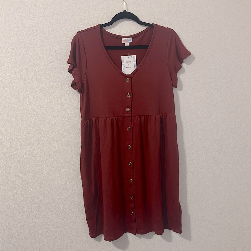 This is a baby doll dress with button down with pockets